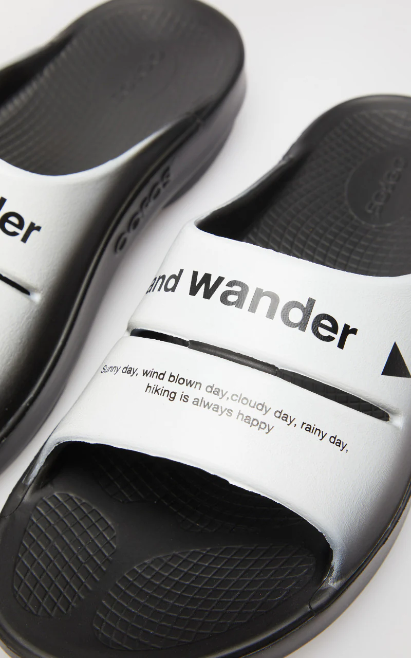 and wander x OOFOS Ooah Slide Black/White - Image 5